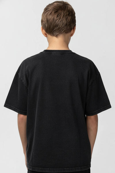 Person wearing a plain black t-shirt on a white background